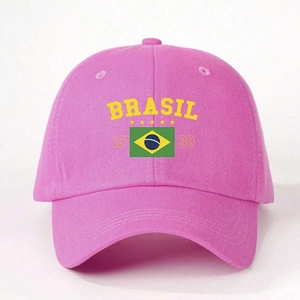 Close-up detail of the yellow Brasil logo and flag embroidery on the pink cotton baseball cap