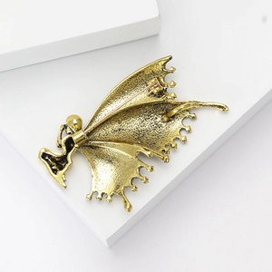 Detailed back view of the golden alloy butterfly brooch showing the pin and clasp mechanism