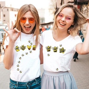 Matching white T-shirts featuring honey bee LOVE alphabet embroidery patches for couples