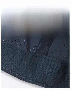 Detail of moisture-wicking sweatband and breathable mesh fabric on navy sports cap