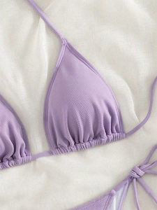 Detail shot of lavender ribbed fabric bikini top with triangular cups and tie-up strings