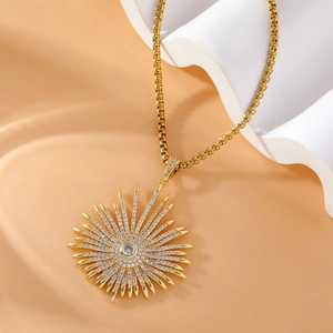 Golden sunburst pendant necklace with micro-paved zircons and stainless steel chain