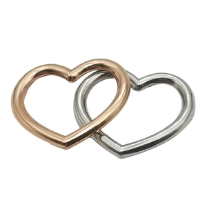 Interlocked gold and silver heart-shaped metal charms for DIY jewelry and accessories