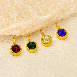 Golden stainless steel round birthstone pendants with red, green, clear and blue zircon