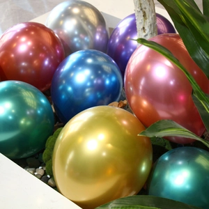 Close-up of vibrant metallic gold and multi-colored latex balloons for party decor