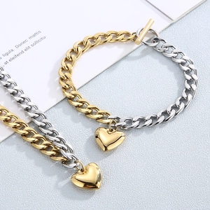 Two-tone stainless steel heart pendant necklace with OT toggle clasp and chain design