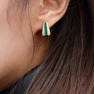 Exotic gold earrings featuring square emerald gemstone and micro-pave diamond accents