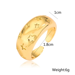Detail view of gold star-embossed open ring showing 1cm width and 1.8cm diameter