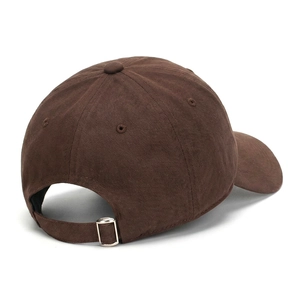 Detail of adjustable silver metal buckle on deep brown cotton twill baseball cap back