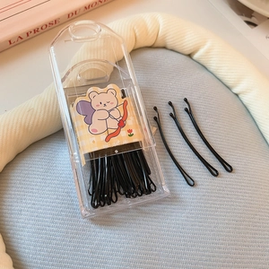 Set of black minimalist hair clips in a clear storage box with a cute bear card