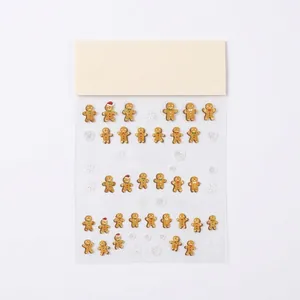 5D embossed Christmas nail art stickers featuring gingerbread man and snowflake designs