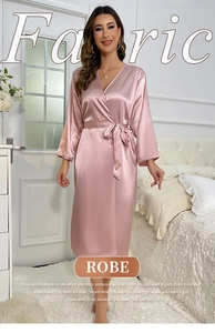 Detailed close-up of smooth satin fabric and sleek robe texture in dusty pink