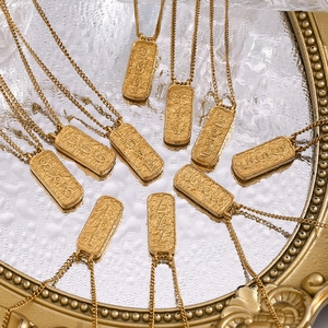 Detailed view of gold 18K plated stainless steel tarot necklaces with engraved numbers