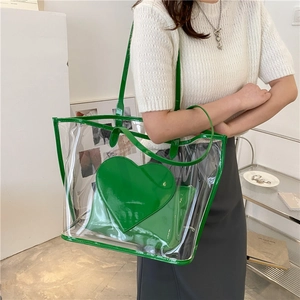 Transparent PVC tote bag with green heart patch and contrast trim for women