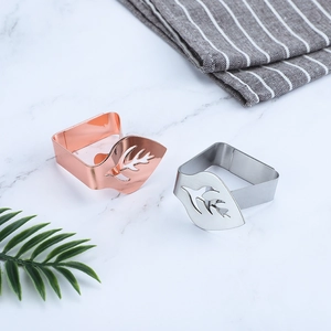 Leaf-shaped stainless steel tablecloth clips in silver and rose gold finishes