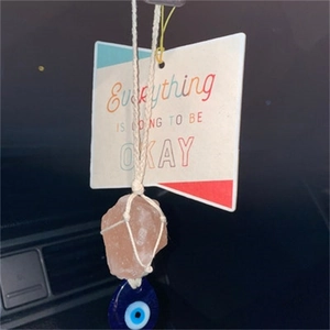 Pink crystal car mirror charm with blue evil eye bead and motivational tag