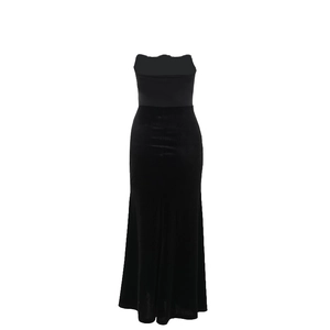 Detail of elegant black velvet patchwork strapless waist-hugging dress on white background