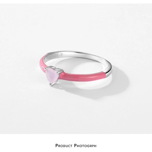 Macro shot of S925 silver ring featuring pink heart zircon and enamel finish details