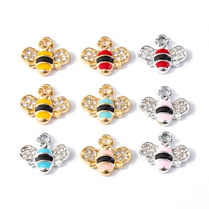 Detailed view of nine colorful enamel honey bee pendants with sparkling rhinestone wings