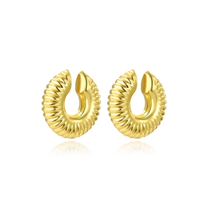 Detail view of gold twisted croissant clip-on earrings with polished ribbed texture