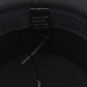 Detail view of inner fabric tag showing 65% cotton and 35% polyester material blend