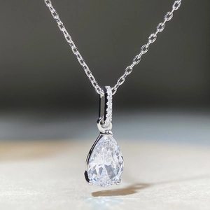 Macro shot of S925 sterling silver necklace with teardrop zircon in a three-prong setting