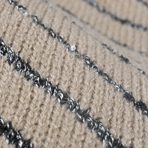 Women's warm striped knit beanie with fleece lining in beige and black pattern