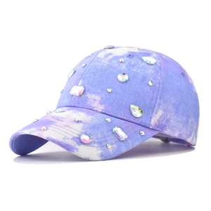 Tie-dye baseball cap with colorful rhinestones and blue sapphire-style gems on cotton canvas