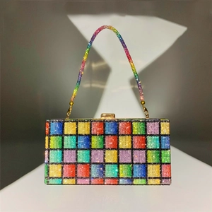 Macro detail showing colorful rainbow crystal checkerboard pattern and gold hardware
