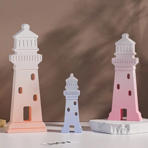 Three sizes of matte lighthouse silicone molds in pink and blue for DIY decor