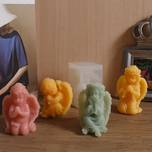 Detailed view of pastel angel candles with intricate wings and 3D silicone mold