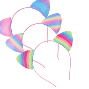 Close-up of glitter cat ear headbands in a colorful rainbow gradient with pink frames