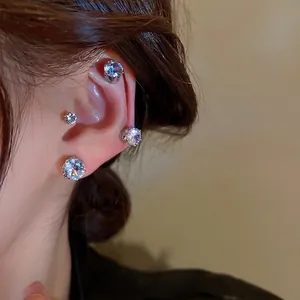 Magnetic cubic zirconia clip-on earrings set shown on ear in a minimalist style