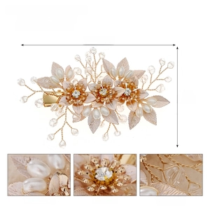 Detailed close-up showing pearls, rhinestones, and crystals on a gold bridal hair clip