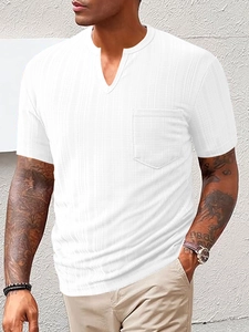 Detail of white V-neck T-shirt showing waffle texture fabric and chest pocket detail