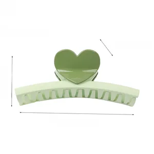 Green heart-shaped hair claw clip dimensions showing 13cm length and 33g weight