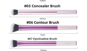 Detailed view of concealer, contour, and eyeshadow brushes with purple gradient handles