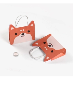 Close-up of cute orange shiba inu cartoon gift bags with 3D ears and white handles