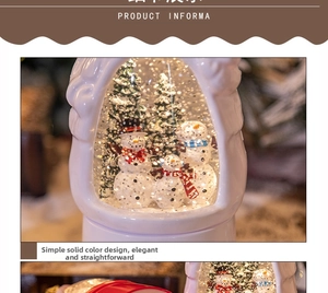 Close-up of a decorative Christmas snowman snow globe music box with warm lighting