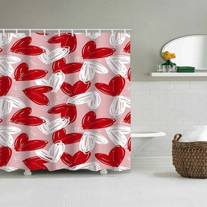 Detail view of pink Valentine shower curtain with heart patterns and plastic rings