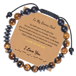 Close-up of Morse code tiger eye stone bracelet with heartfelt card for stepfather