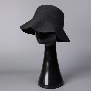 Detailed close-up of the fine texture and weave on this black foldable sun bucket hat