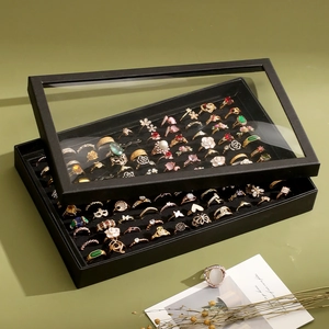 Black 100-slot ring display box with transparent dustproof lid and velvet interior