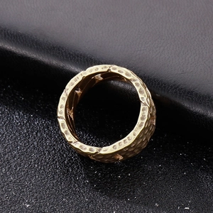 Vintage gold hammer-textured titanium steel ring with rugged lava finish for men