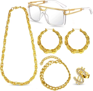 Close-up of 5-piece gold hip hop set including chain necklace, dollar ring, and glasses