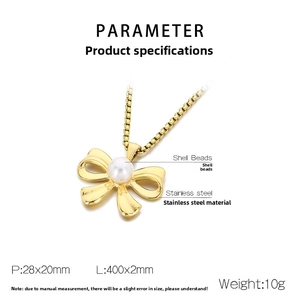 Detailed specs of bowknot pendant with pearl on a gold stainless steel necklace