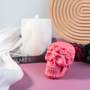 Detailed macro view of skull candle mold with floral carving and silicone texture