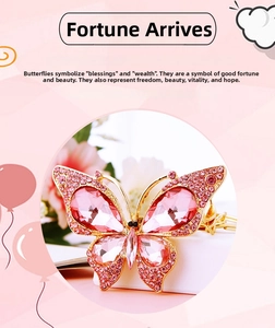 Detail of pink crystal butterfly charm with sparkling rhinestones and alloy base
