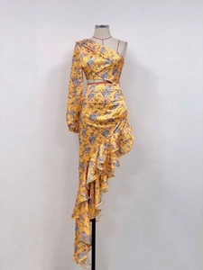 Detailed view of floral one-shoulder cropped top and irregular ruffle skirt set