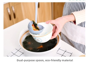 Dual-purpose blue wheat straw soup spoon with integrated strainer pouring broth into a bowl